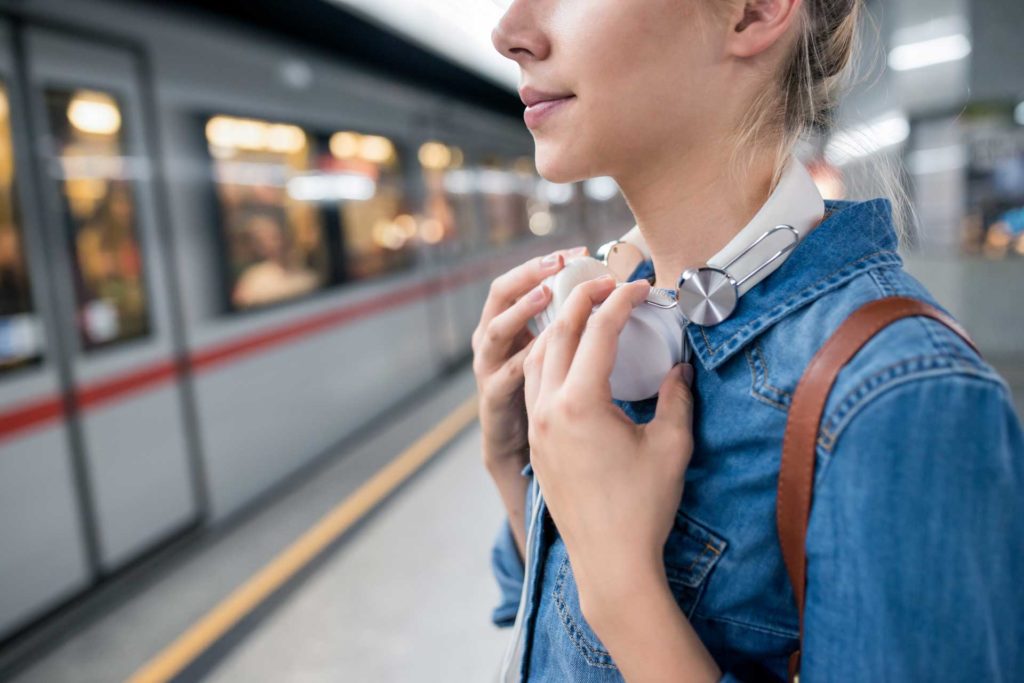 Unrecognizable-young-woman-waiting-at-the-underground-platformShutterstock-496729072