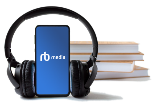 phone-and-headphones-in-the-background-of-books.-concept-choice-of-technology-or-classics.-1289251296_2115x1423